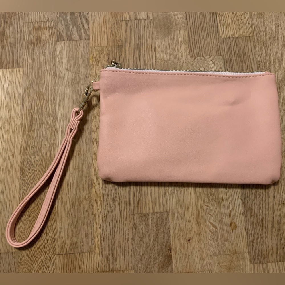 Pink clutch with phone charger insert